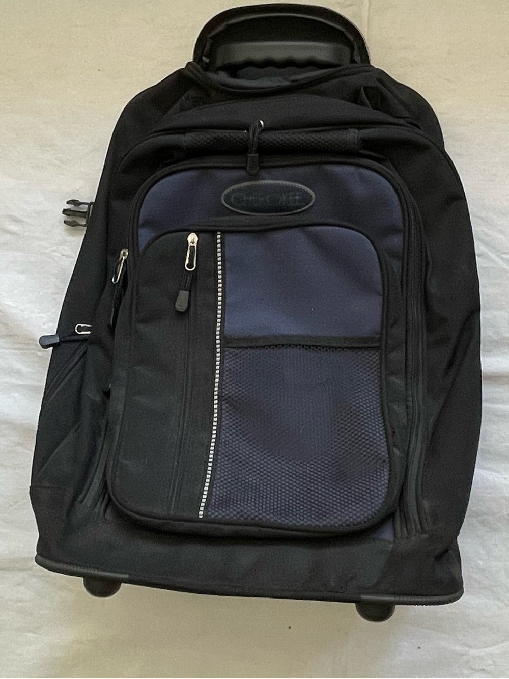 High Sierra Black and Navy Rolling Travel Backpack